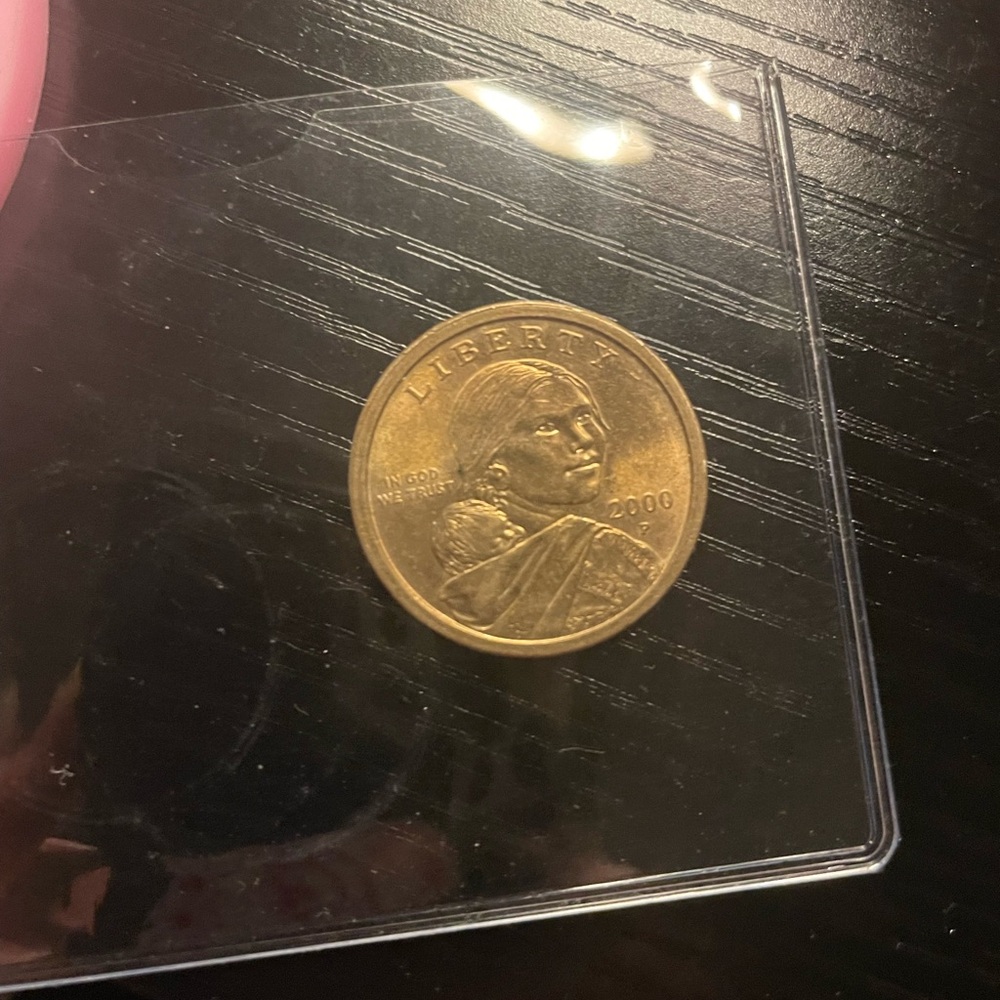 2000 Gold-Toned Coin in Protective Sleeve